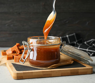 Caramel Collagen dripping off of a spoon